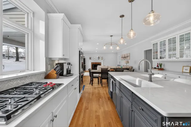 a kitchen with lots of counter top space and appliances