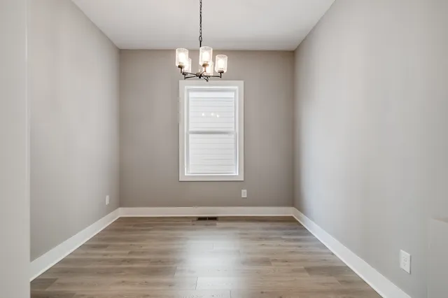 a view of a livingroom with a dishwasher cabinets and a window