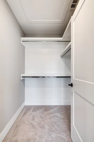 a view of an empty walk in closet