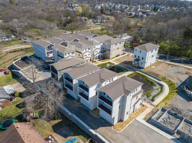 an aerial view of a house with a garden