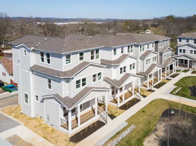 an aerial view of a house with a swimming pool