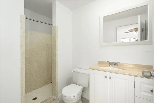 a bathroom with a toilet a sink and a shower