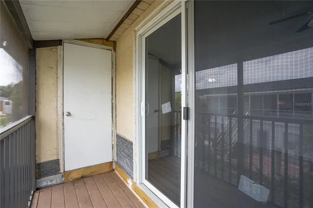a bathroom with a glass door shower and a window