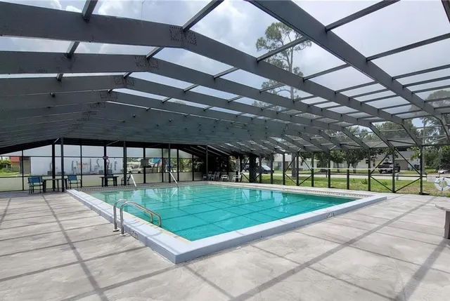 a view of a swimming pool with a yard