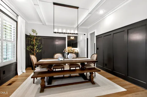 a room with pool table and windows