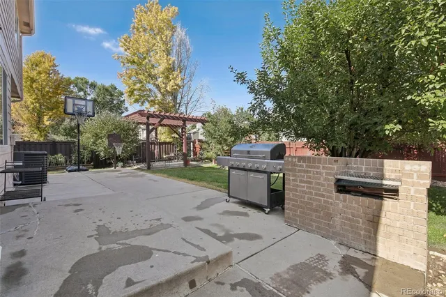 a couple of cars parked in front of a house