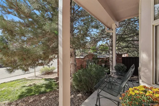 a view of a backyard with sitting area
