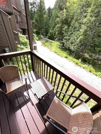 a view of a balcony with wooden floor