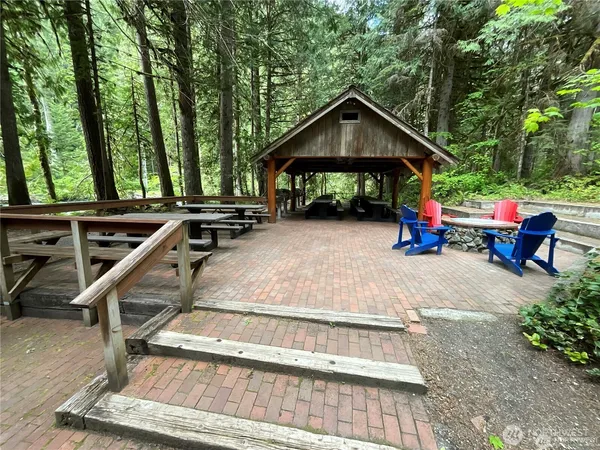 a view of house with outdoor seating area
