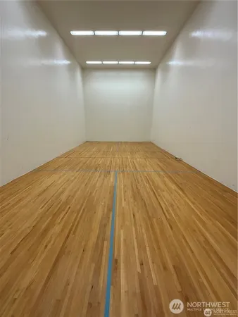 an empty room with wooden floor