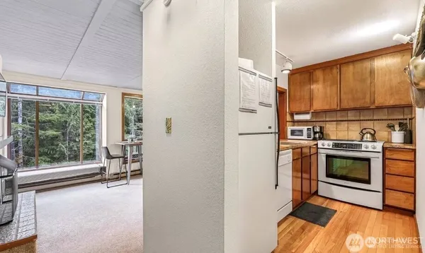 a kitchen with stainless steel appliances a stove sink and refrigerator