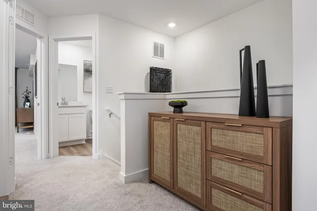 a bedroom with bed and a chandelier