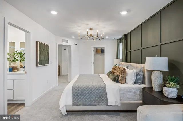 a bathroom with a shower sink and mirror