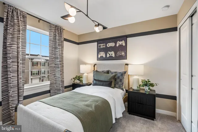 a view of a bedroom with furniture and windows