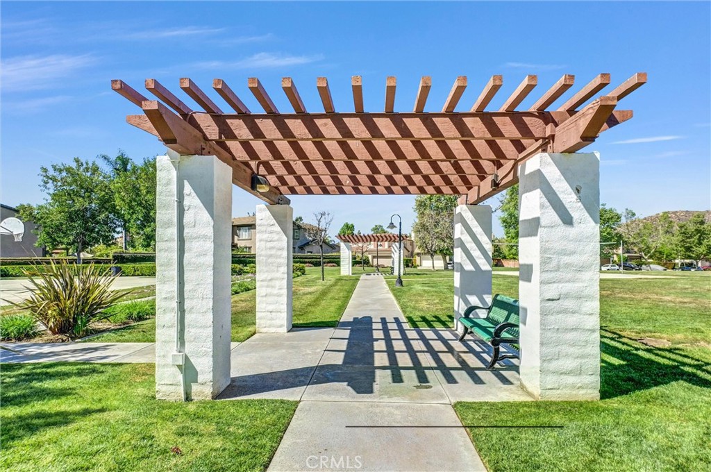 11499 Bridgeway Drive Riverside, CA 92505 - Photo 66 of 70 a view of a backyard with couches plants and wooden fence