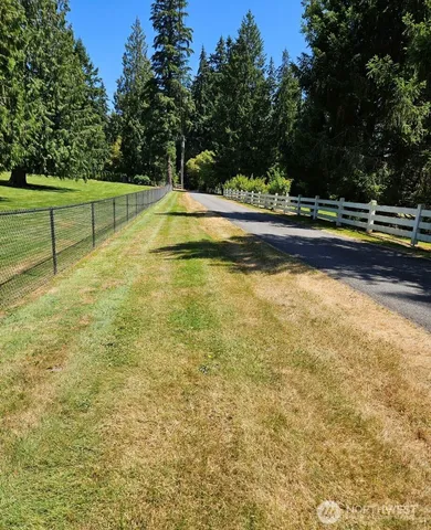 a view of a swimming pool with an outdoor space and seating area