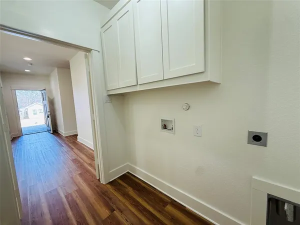 a view of hallway with wooden floor