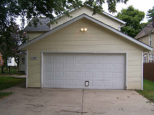 920 North 10th Street Rochelle, IL 61068 - Photo 10 of 10 a front view of a house with a yard and garage