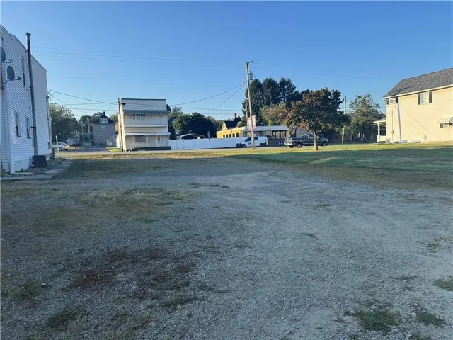 a view of a big yard with a house