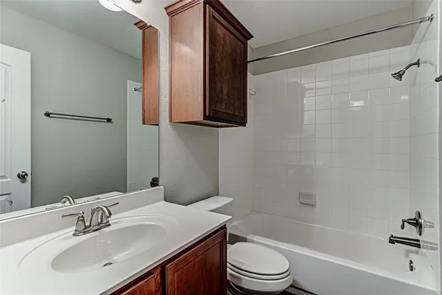 a bathroom with a sink a toilet and a bathtub