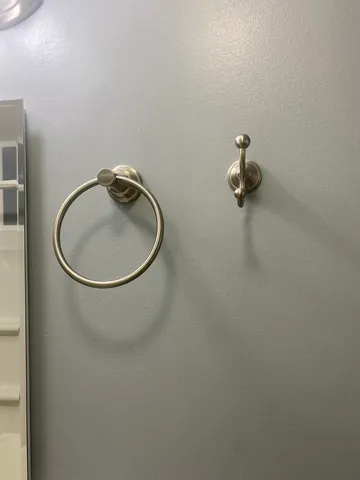 a white toilet sitting next to a bathroom sink