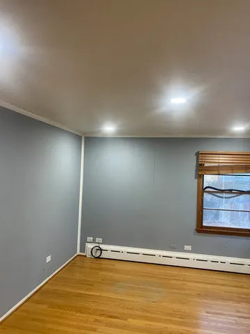 a view of house with backyard