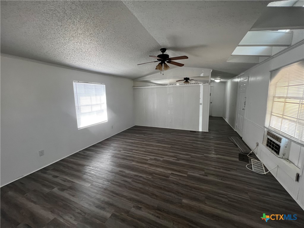 1405 Harris Hill Road, Unit 1405 San Marcos, TX 78666 - Photo 3 of 14 a view of empty room with wooden floor and fan