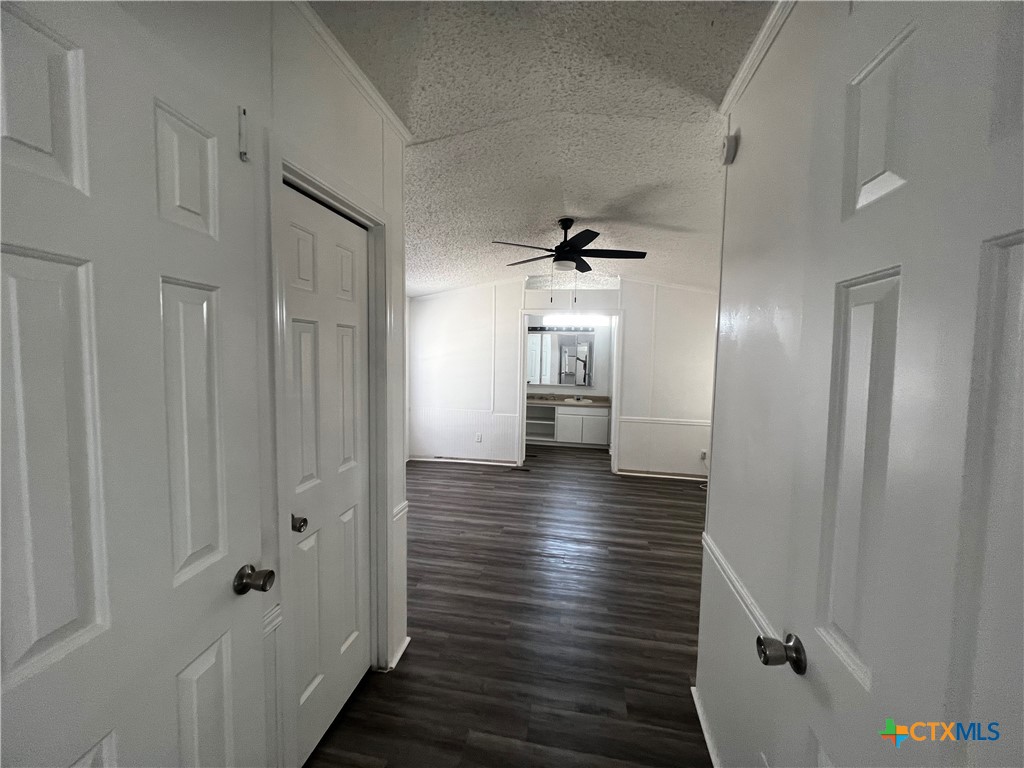 1405 Harris Hill Road, Unit 1405 San Marcos, TX 78666 - Photo 4 of 14 a view of hallway with wooden floor