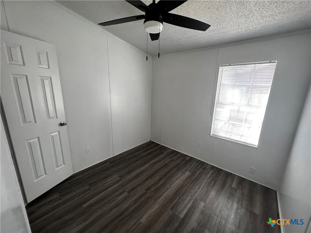 1405 Harris Hill Road, Unit 1405 San Marcos, TX 78666 - Photo 10 of 14 a view of an empty room with a window