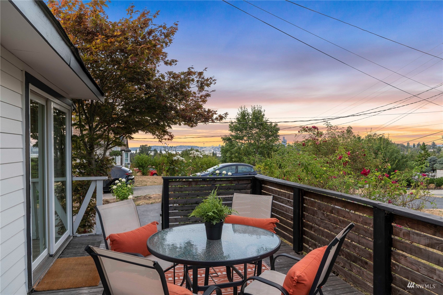 a view of a balcony with table and chairs
