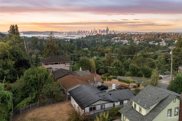 an aerial view of residential building and lake