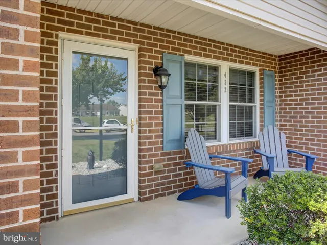 a balcony with table and chairs