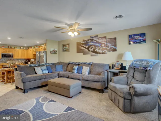 a living room with furniture and a view