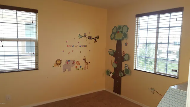 a view of a room with window and a mirror