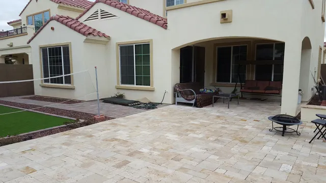 a view of house with yard and furniture