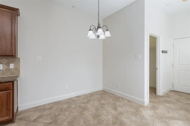 a view of a chandelier fan in a room