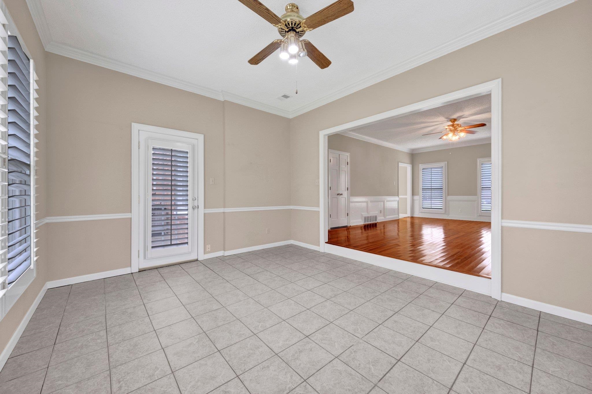 4050 High Plains Road Bartlett, TN 38135 - Photo 28 of 36 Spare room with a ceiling fan, light tile patterned flooring, crown molding, and baseboards
