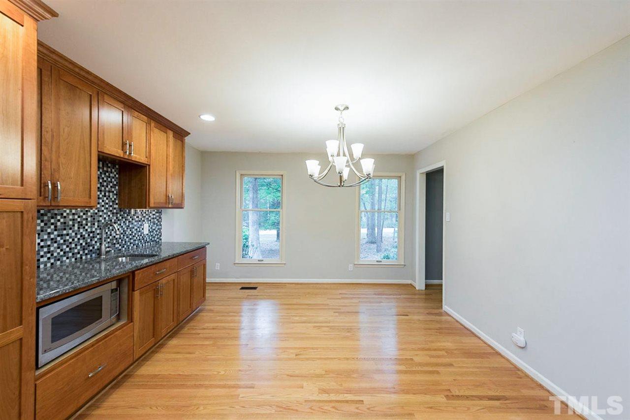 5208 Hallmark Road Durham, NC 27712 - Photo 12 of 25 a view of a kitchen with a sink and microwave