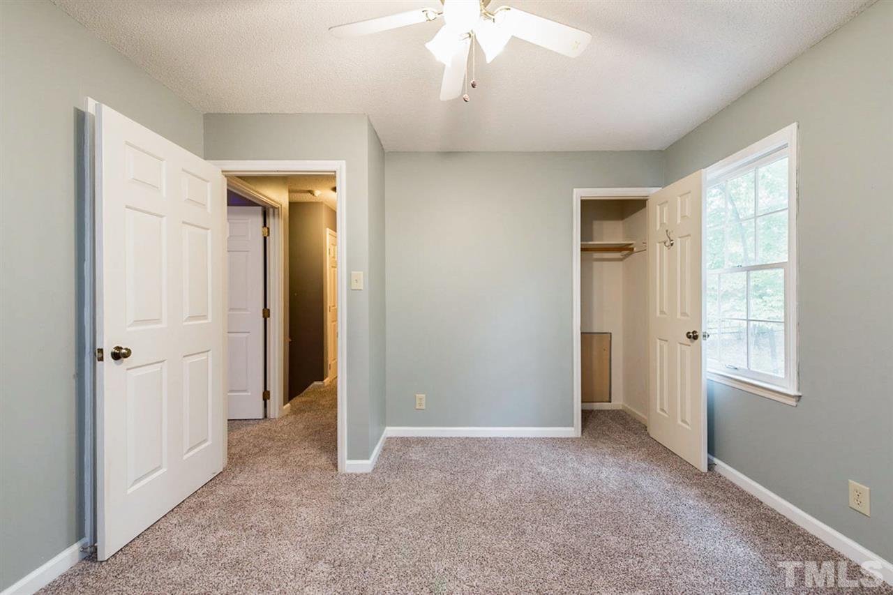 5208 Hallmark Road Durham, NC 27712 - Photo 17 of 25 an empty room with windows and closet
