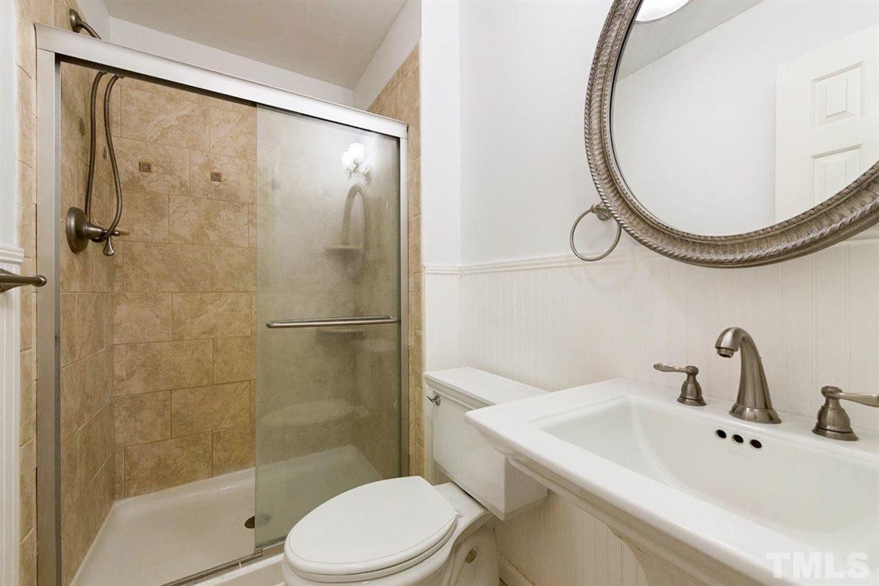 5208 Hallmark Road Durham, NC 27712 - Photo 20 of 25 a bathroom with a sink and a mirror