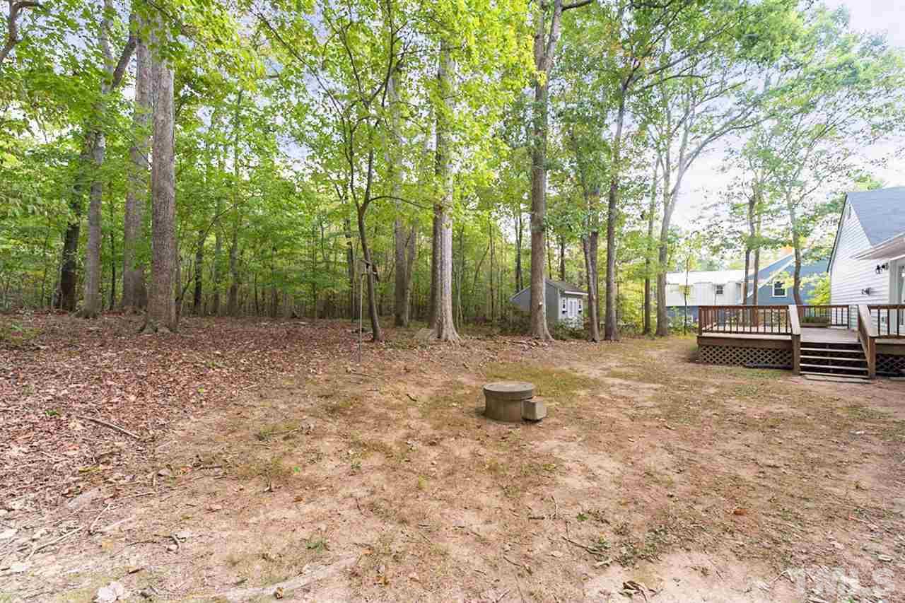 5208 Hallmark Road Durham, NC 27712 - Photo 23 of 25 a backyard of a house with lots of green space