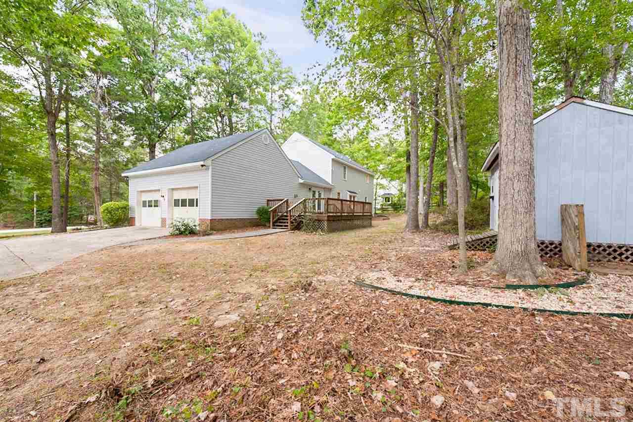 5208 Hallmark Road Durham, NC 27712 - Photo 24 of 25 a view of a house with a yard and large tree