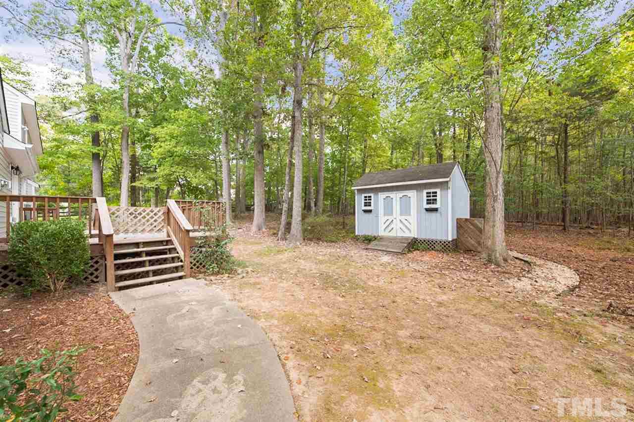 5208 Hallmark Road Durham, NC 27712 - Photo 25 of 25 a view of a house with backyard and a tree