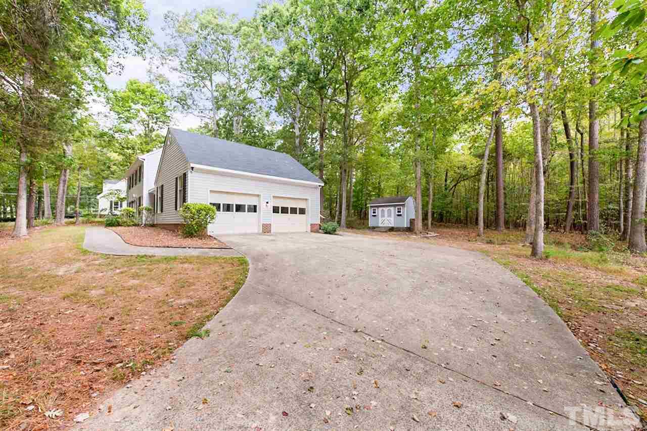 5208 Hallmark Road Durham, NC 27712 - Photo 6 of 25 a view of a yard with plants and trees