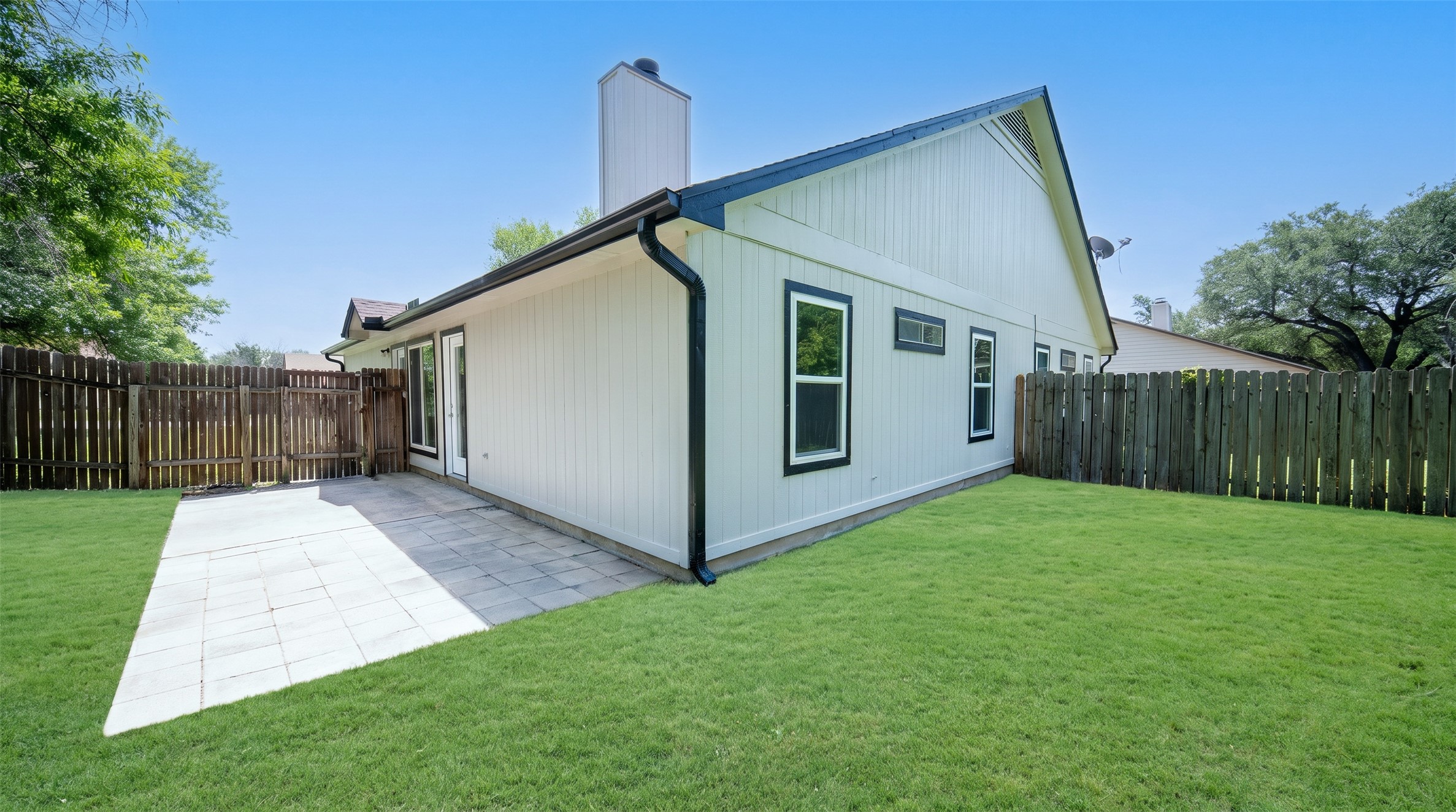 339 Fantail Loop, Unit B Austin, TX 78734 - Photo 10 of 21 a view of backyard with small cabin and wooden fence