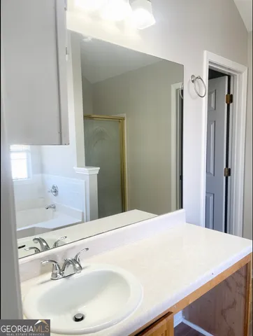 a bathroom with a sink and a mirror