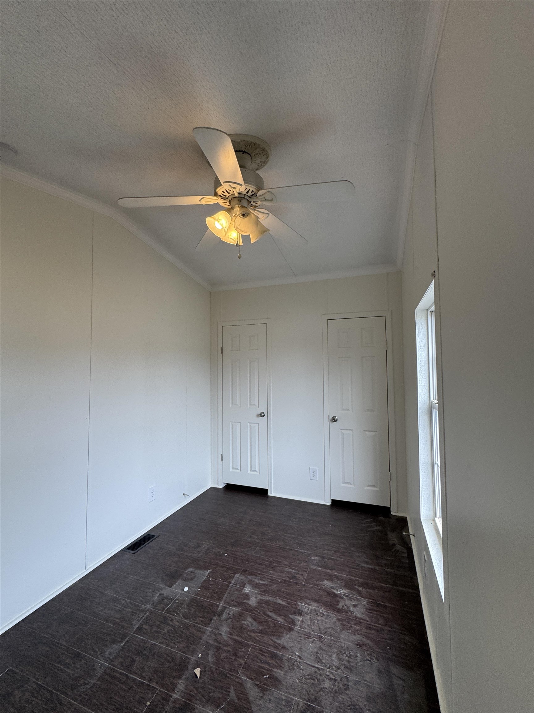 42 Reed Circle Bertram, TX 78605 - Photo 15 of 28 an empty room with a stove and wooden floor