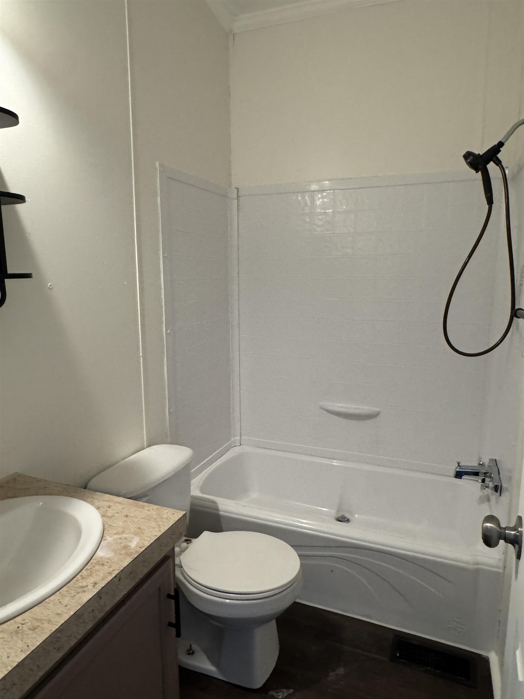 42 Reed Circle Bertram, TX 78605 - Photo 17 of 28 a bathroom with a granite countertop bathtub sink vanity mirror and toilet