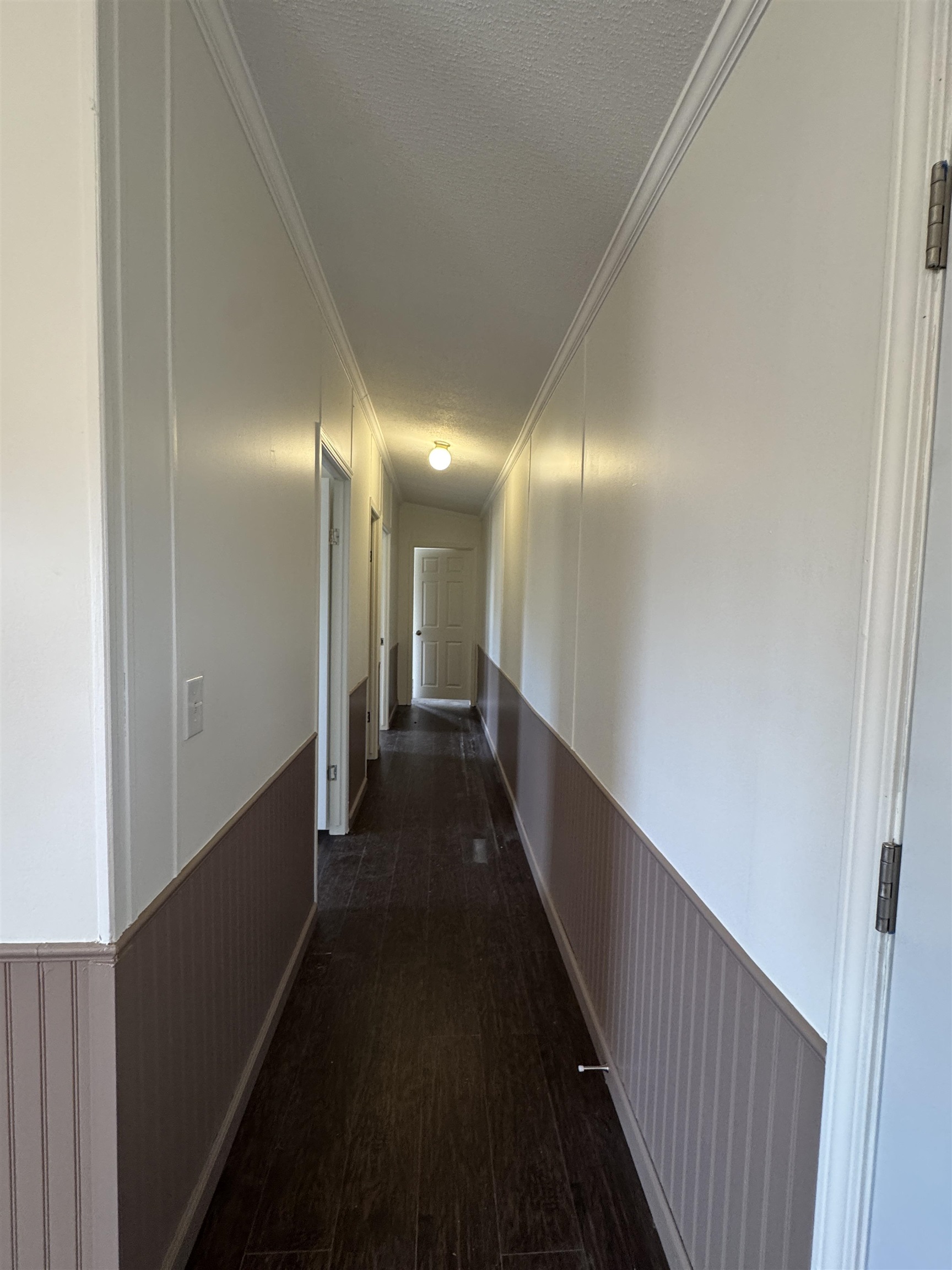 42 Reed Circle Bertram, TX 78605 - Photo 18 of 28 a view of a hallway with wooden floor