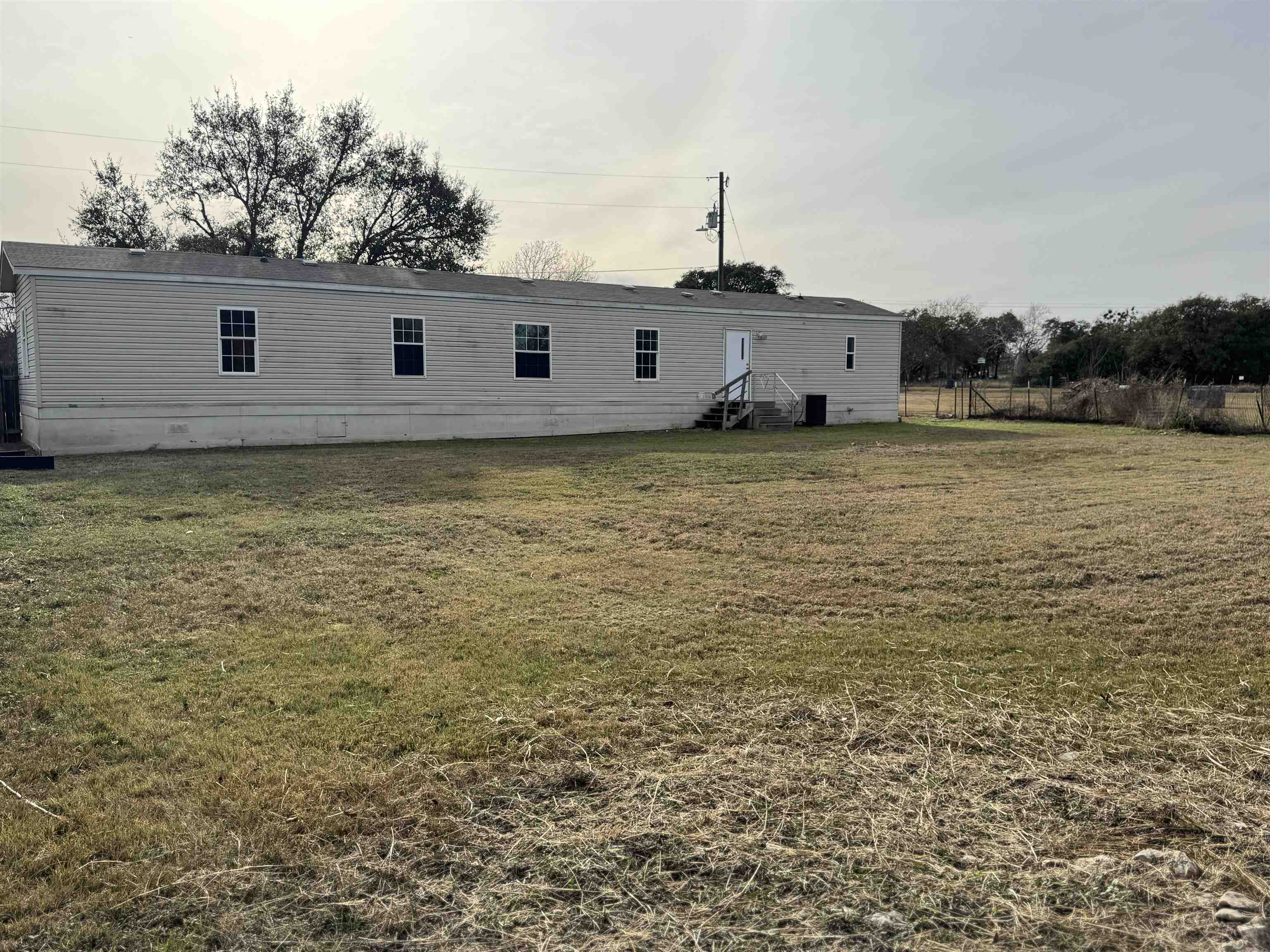 42 Reed Circle Bertram, TX 78605 - Photo 19 of 28 a view of a large pool with a yard